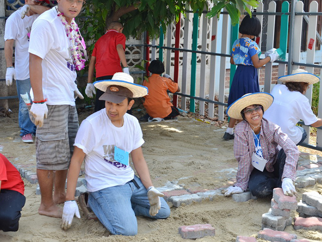 Volunteers smiling to the camera